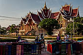 Vientiane, Laos - Pha That Luang, Outside the walled area are souvenir shops and food stalls. 